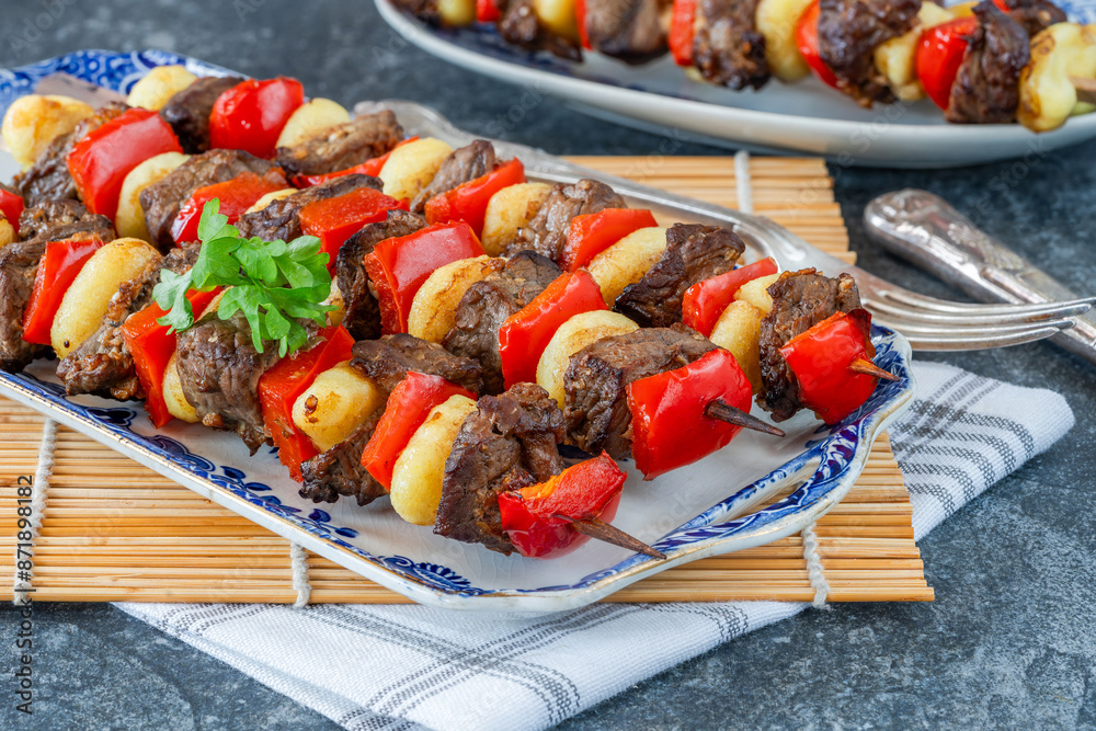 Poster Grilled gnocchi, steak and red pepper skewers