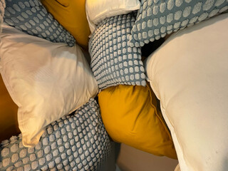 colored cushions arranged in a confusing way used as a wall to create a texture