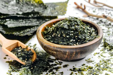 Green nori seaweed kelp alga powder flake on white background