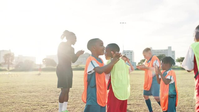 Football, hands and coach with children for celebration, motivation and team spirit for sport competition. Soccer field, applause and trainer with players for win, achievement and confidence boost