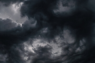 Dark storm clouds gathering in sky creating dramatic scene