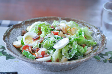 caesar salad or vegetable salad with bacon , egg and Bread Croutons