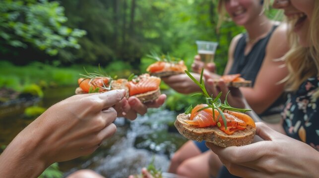 Against a backdrop of lush greenery and babbling brooks a group of friends share laughs and bites of savory oatcakes topped with locally sourced smoked salmon.