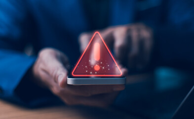 Businessman or it staffs, programmer, developer using Smartphone with triangle caution warning sign...