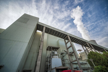 Fototapeta premium Contrasting Scene of Industrial Power Plant and Farm Land