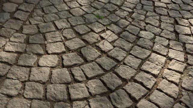 4k, Top view of the granite cobblestone road in motion, on walk, in the Peter and Paul Fortress, at daytime, Saint Petersburg, Russia 
