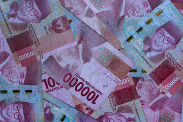 stack of one hundred thousand Indonesian rupiah notes