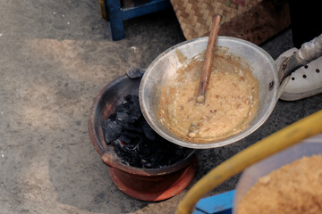 a typical food from betawi the province of DKI Jakarta, Indonesia made from eggs and sticky rice usually called kerak telor, being cooked in the traditional way