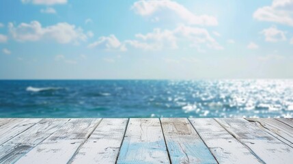 Obraz premium White horizontal wooden table top With a blurry background of the sea and sky. 