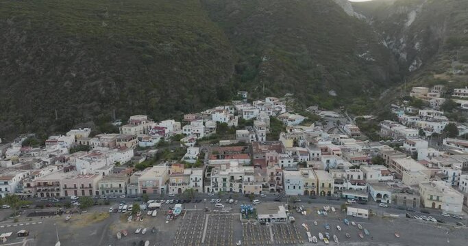 Aerial view of historic village by the Mediterranean coast at sunset, Lipari, Aeolian Islands, Italy.