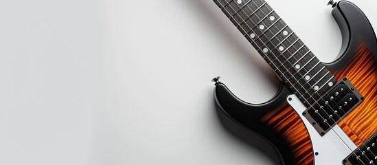 Close-up of an electric guitar on a white backdrop with copy space image.