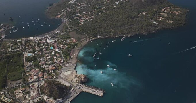 Aerial view of winding coastal road overlooking the bay and village of Vulcano Porto, Aeolian Islands, Italy.