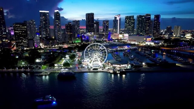 Skyviews Miami Observation Wheel at Bayside Marketplace with reflections in Biscayne Bay water