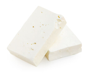 Feta cheese isolated. Greek fitaki cheese pieces on white background. Top view.