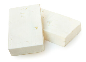 Feta cheese isolated. Greek fitaki cheese pieces on white background. Top view.