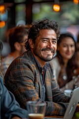 Fototapeta premium a group of 4 Mexican professionals collaborating in an office in front of a lap top, some of them drink coffee and show that they are happy in their work day, Sony a7R IV camera, Meike 85mm F1