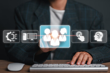 A person interacting with a digital interface, showcasing icons related to technology,...