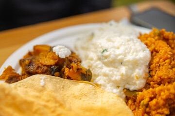 the indian street food in a disposable paper trays