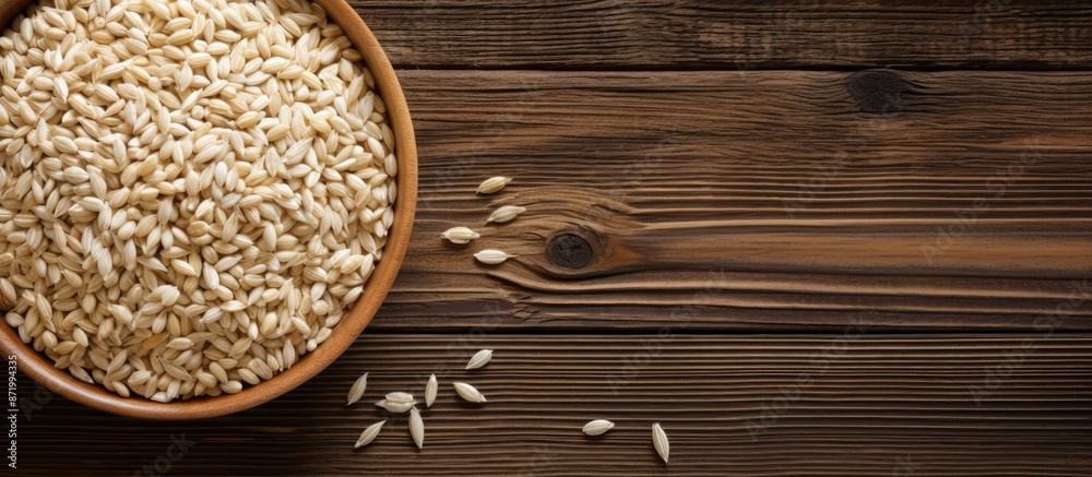 Poster pearl barley grain set against a rustic wooden backdrop with copy space image.