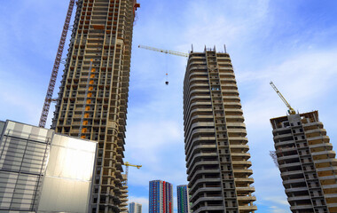 Skyscraper Construction. Tower Crane on formworks on construction site. Construction crane on Housing. Construction of Multi Storey Residential Building. Skyscraper built. Tower Cranes on building.