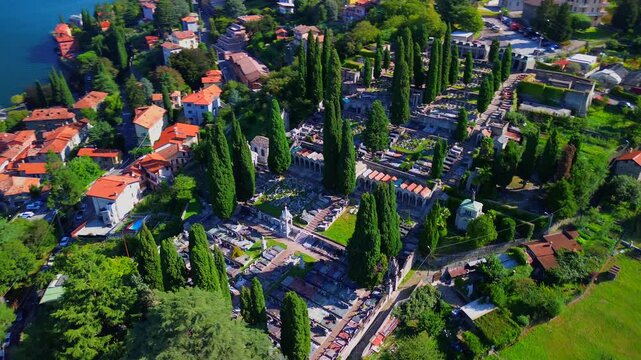 Aerial view of Lake Como. city ​​center. Bell tower. Tourism and romance. Mountains around the lake. Red roofs. Green Planet. Sailing yacht. Powerboat. travel to Italy, Bellano, 12.07.2024