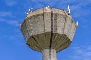 Tall Concrete Tower Water Supply for Village With Cell Phone Gsm Antennas