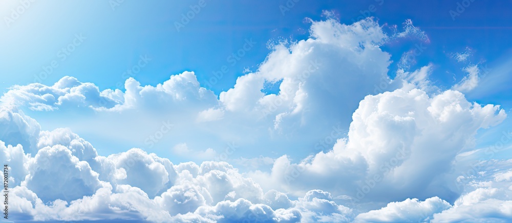 Aufkleber sunny weather with bright blue sky and fluffy white clouds, ideal as a nature-themed background. the