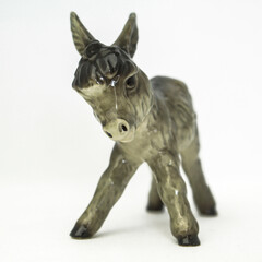 Fototapeta premium Porcelain donkey isolated on a white back