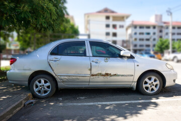 The color of the car body is decaying. surface of the old car is rusty and corroded