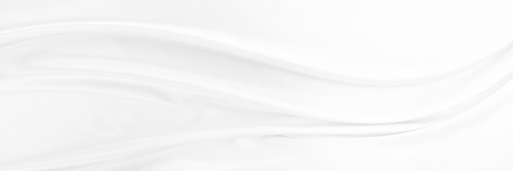 White gray satin texture that is white silver fabric silk panorama background with beautiful soft blur pattern natural.