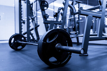 Fototapeta premium Modern Gym Interior with Barbell Equipment