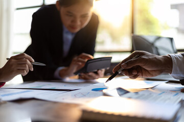 Business meeting, Company executives meeting discussing strategic analysis and business planning, group of people working with paperwork on a board room table at a business presentation or seminar.