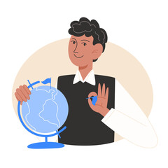 A schoolboy holds a globe of the earth in his hands and makes marks