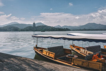 Tranquil Lakeside Boats and Scenic Mountain Landscape