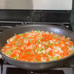 Mirepoix, chopped vegetable cut, mixture of onion, carrot and celery sautéing with olive oil