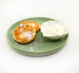 Delicious cheesecakes with powder and sour cream