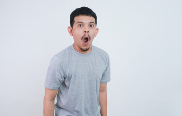 Obraz premium Surprised shocked face asian man isolated on white background for advertisement.