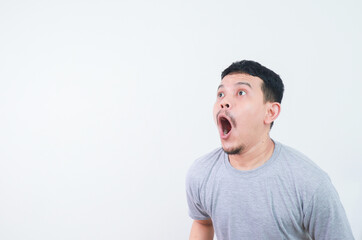 Surprised shocked face asian man isolated on white background for advertisement.