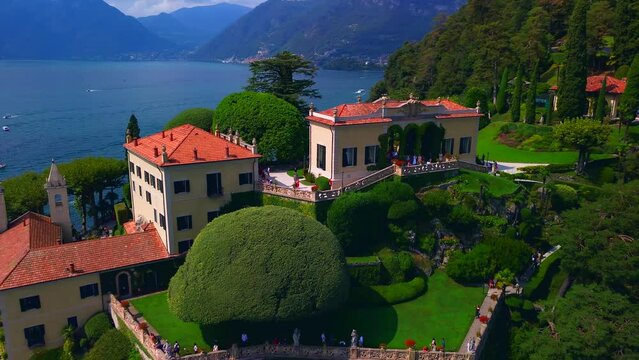 Aerial view of the luxury Villa Balbianello with terraced gardens, on the rocky wooded peninsula of Lavedo on Lake Como, panorama, picturesque residence. Green Planet. Nature. Lenno Italy 12.07.2024