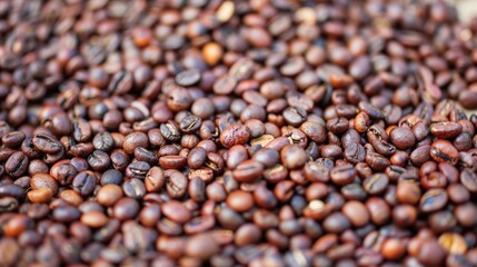 A macro view of roasted coffee beans, showcasing their intricate details