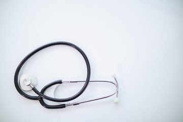 Fototapeta premium Doctors use stethoscope to listen patient heartbeat to find faults in heart disease. Doctors use stethoscope to listen patient heart rate to gather information diagnose disease and provide treatment.