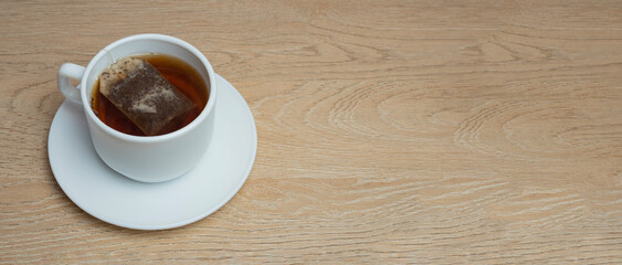 cup of tea on a wooden background. copy space