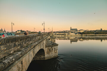 Fototapeta premium A tranquil sunset over the stone bridge in tours