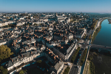 Obraz premium A river runs through it: an aerial view of the city of saumur, france