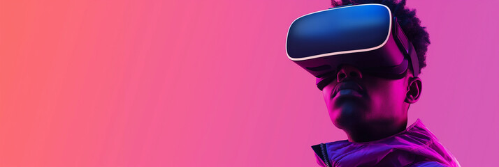 Young man exploring virtual reality using vr headset on gradient background