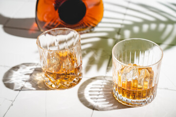 Whiskey with ice in glasses
