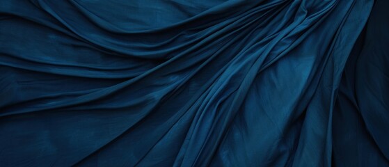 Abstract blue fabric texture with soft folds and wrinkles.