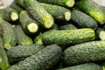 Closeup view of a pile of cucumbers	
