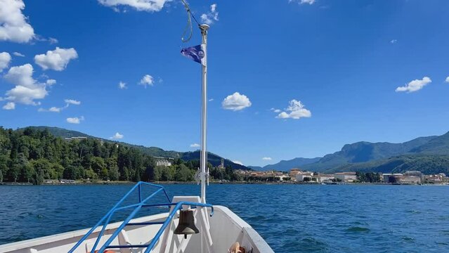 Time lapse of ferry boat approaching harbour of Luino, Lago Maggiore, Italy.