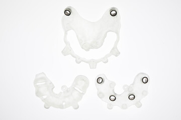 components of a surgical dental template, top view on a white background
